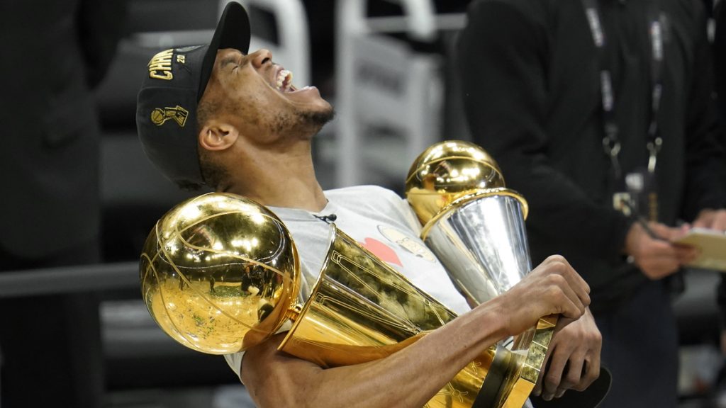 Giannis holds trophies